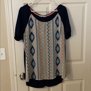 Maurice’s size 2 top.  Aztec print and button back